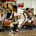 Milan senior Ernest Davis picks up a loose ball and runs on Friday. Daniel Brenner I AnnArbor.com